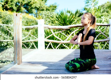 10 Years Old Kid Girl Doing Yoga Asana In The Nature.