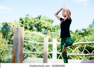 10 Years Old Kid Girl Doing Yoga Asana In The Nature.