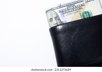 100 American dollar currency in a wallet with copy space , Focus on eye of Franklin on banknotes - Shutterstock ID 2311273639
