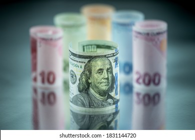 100 american dollars standing in front of Turkish money.
Reflection and macro shot