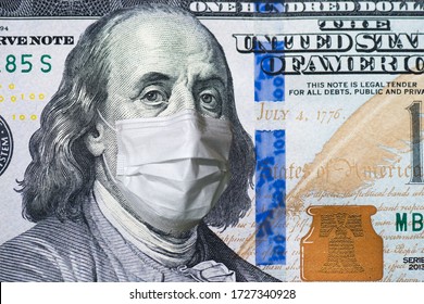 A $ 100 Bill In A Medical Mask. World Economy During The COVID-19 Pandemic