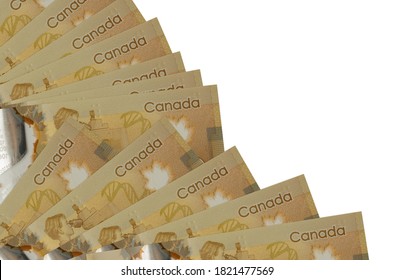 100 Canadian Dollars Bills Lies Isolated On White Background With Copy Space Stacked In Fan Close Up