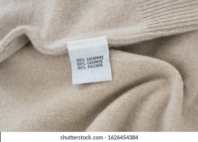 100 % cashmere label on cashmere background