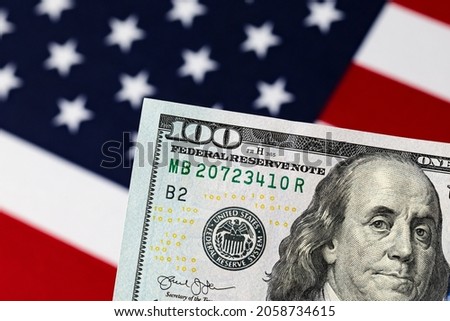 100 dollar bill with American flag. Debt ceiling, stock market and financial concept.