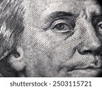 100 dollar bill with Benjamin Franklin face macro shot. Close up portrait of Benjamin Franklin on one hundred dollar bil