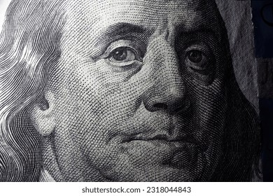100 dollar bill with Benjamin Franklin face macro shot. Close up portrait of Benjamin Franklin on one hundred dollar bill - Shutterstock ID 2318044843