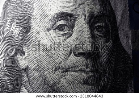 100 dollar bill with Benjamin Franklin face macro shot. Close up portrait of Benjamin Franklin on one hundred dollar bill