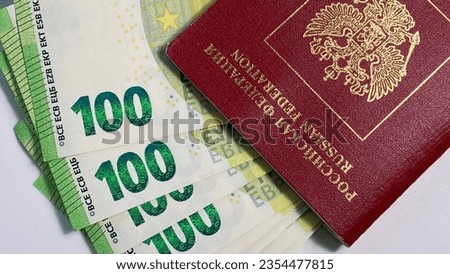 100 euro banknotes are enclosed in the passport of the Russian Federation. Close-up. One hundred euro cash notes. The single currency of the European Union. Financial business background concept.
