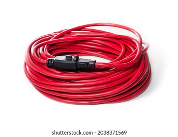 100 feet extension cord, bundled up.   Red single outlet power cord for outdoor use with locking receptacle. Medium to heavy duty gauge. Selective focus. Isolated on white.