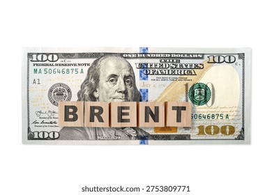 100 US dollar note on a USA flag with wooden cubes and word BRENT. USA trade, duty, customs and tariffs war. Economic inflation, deflation or stagflation 