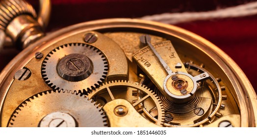 100 years old original golden pocket watch close up red background - Powered by Shutterstock