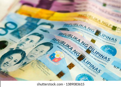 1000 Philippine pesos with other banknotes in the background