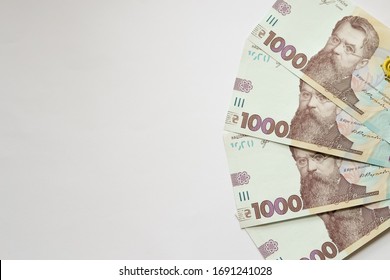 1000 Ukrainian Money Hryvnia On White Background. Business Flat Lay With Copy Space For Text. Crisis And Problem Of Financial Turbulence, Inflation, Devalvation, Economics Depression.