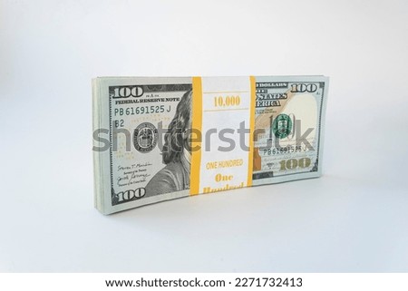 10,000 dollars packed in a bundle on a white background. Business saving concept. lot of money.