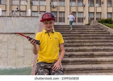 10.05.2019, Tula, Russia. Two Boys Running Up And Down By Stairs. Children Having Fun.