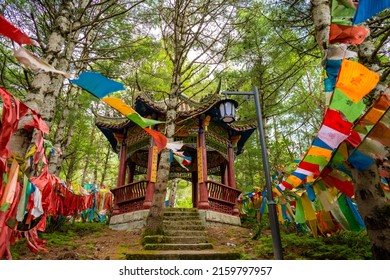 10.07.2021 Kangding, Sichuan, China. Buddhist praying flags with mantras in the forest at the top of the mountains. Tibetan buddhism 