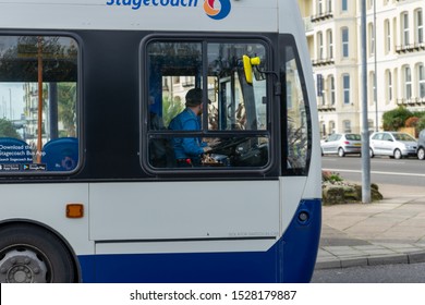 10/09/2019 Portsmouth, Hampshire, UK A Bus Driver In The Cab Of A Stagecoach Bus Behind The Wheel