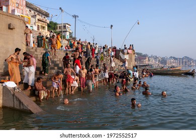 10.16.06. Varanasi. India. Hindu devotees bathing at the Hindu Ghats on the banks of the Holy River Ganges at Banaras in northern India.