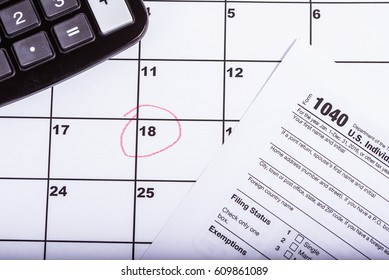 1040 Tax Return With Calender And The 18th Circled In Red