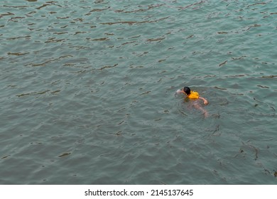 10-APRIL-2019 - Songkran Day, people come to have enjoying at the Ping River. Kamphaeng Phet Province, Thailand. girl swimming.