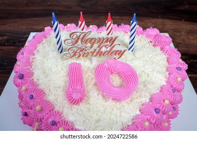 10th Birthday Cake On A Wooden Table