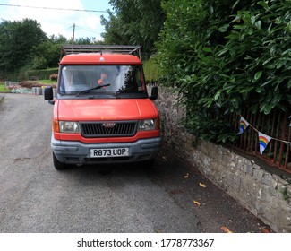 10th July 2020- An Old Red Ex Royal Mail Van Parked On A Lane  Near Laugharne, Carmarthenshire, Wales, UK.