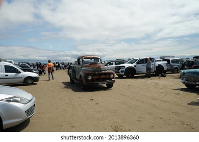 10th July 2021- A Ford F Series Truck Being Driven Through The Public Parking Area On The Sandy Beach At Pendine, Carmarthenshire, Wales, UK.