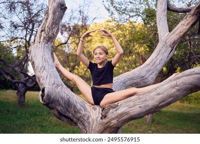               10-year-old gymnast practices in the garden                 - Powered by Shutterstock