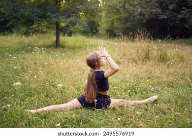               10-year-old gymnast practices in the garden                 - Powered by Shutterstock