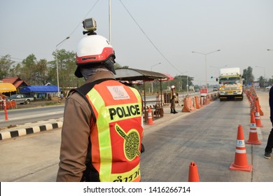 11 April 2019 Song District Phrae Thailand, Dan NangFha intersection  checkpoint traffic police stand at roadside  to warn traffic violators on streets.