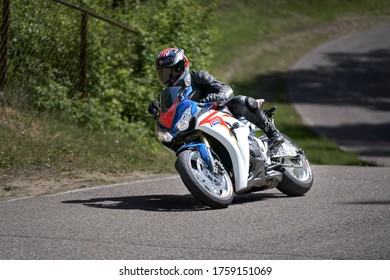 11-05-2020 Riga, Latvia Motorcyclist At Sport Bike Rides By Empty Asphalt Road. Sport Bike.