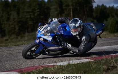 11-05-2020 Riga, Latvia Motorcyclist At Sport Bike Rides By Empty Asphalt Road. Sport Bike.