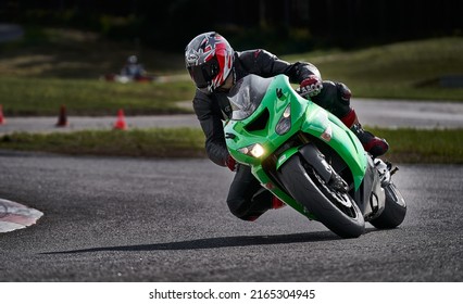 11-05-2020 Riga, Latvia Motorcyclist At Sport Bike Rides By Empty Asphalt Road. Sport Bike.