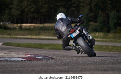 11-05-2020 Riga, Latvia Motorcyclist At Sport Bike Rides By Empty Asphalt Road. Sport Bike.