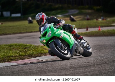 11-05-2020 Riga, Latvia Motorcyclist At Sport Bike Rides By Empty Asphalt Road. Sport Bike.