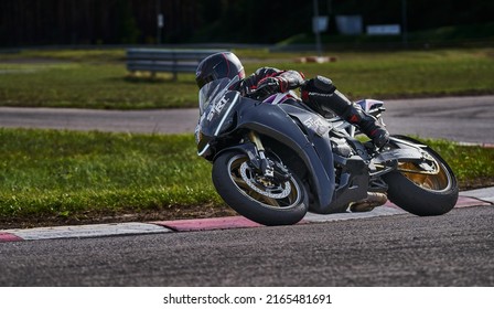 11-05-2020 Riga, Latvia Motorcyclist At Sport Bike Rides By Empty Asphalt Road. Sport Bike.