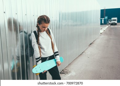 11-12 Years Old Tween Girl Wearing Fashion Sportswear Rollerskating On Skateboard In The City Street, Urban Hipster Style