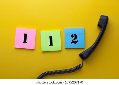 112 (emergency Telephone Number) Written On Note With Phone Handset