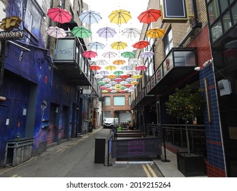 11th June 2021 Dublin, Ireland. Unedited image. Side Street off Grafton Street called Anne's Lane with an umbrella street display outside Zozimus Bar. 