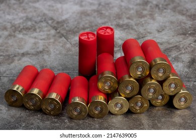 12 Gauge , Red Shotgun Shell Ammunition On Texture Background