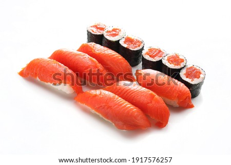 12 piece sushi set. 6 x nigiri and 6x maki with a wild salmon. A packshot photo, isolated on a white background. A Japanese cuisine delicacy.