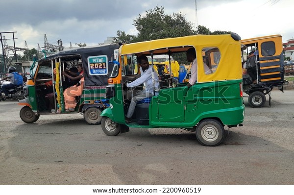 12 September 2022, Kumbh city Prayagraj, Allahabad,\
Uttar Pradesh.  A rickshaw in traffic. A tuktuk rickshaw is on the\
road picking up travellers. A CNG gas auto rickshaw,  tuk tuk is on\
the road.