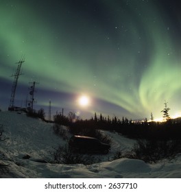 120 film slide scan of aurora borealis (northern lights)  Taken from one of the hills overlooking Fairbanks, Alaska.  Fisheye lens, effect visible