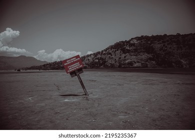 12.07.2022. Marmaris. Turkey. Danger Sign On The Shore Of A Salt Lake. Beautiful Landscape. Dead Salt Lake.