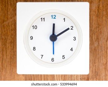 12:10 Time On The Simple White Analog Clock