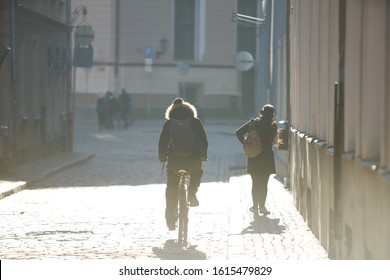 12-10-2018 RIga, Latvia Hipster On Bike In The City At Sunset. Without Face