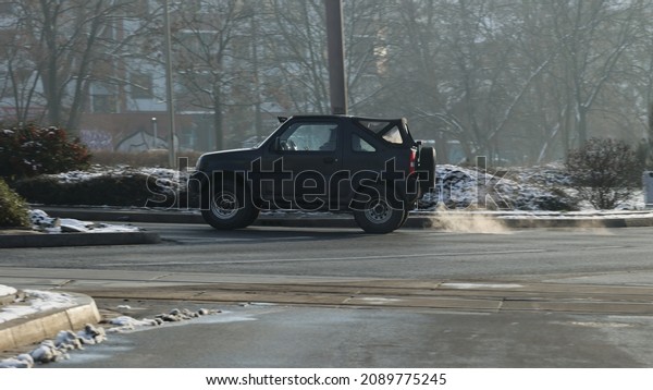 12.12.2021 wroclaw, poland,\
Dangerous smoke comes out of the chimney of a car in a traffic jam\
in the city.