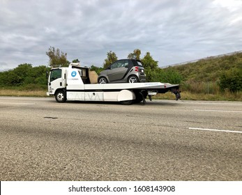 12/22/2019 Orlando FL- Carvana Delivery Truck With Smart Car On Deck