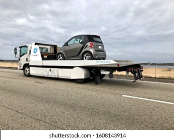 12/22/2019 Orlando FL- Carvana Delivery Truck With Smart Car On Deck