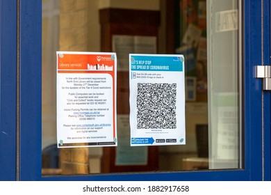 12-27-2020 Portsmouth, Hampshire, UK A NHS Track And Trace QR Code Sign In The Window Of A Library